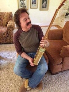 This is Tom Johnston, one of the founders of the Doobie Brothers, checking out a cigar box guitar made for him by Greg Campbell.