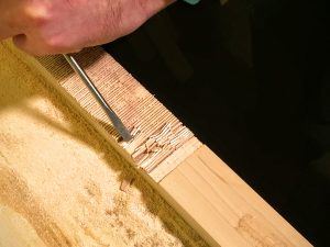 chisel out the notch in the neck