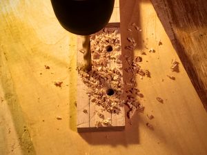 drill holes in the headstock for the tuning pegs