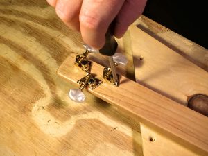 install the tuning pegs