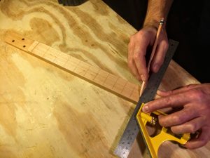 mark the fret lines on the cigar box guitar neck