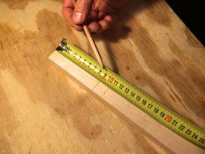 measure down from the top of the neck to the bottom of the headstock