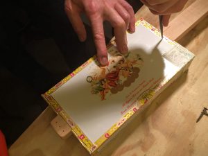 poke guide-holes in the box lid