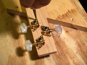 prepare the headstock for tuning peg mounting screws