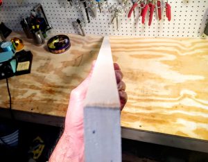 straight length of hardwood for the neck