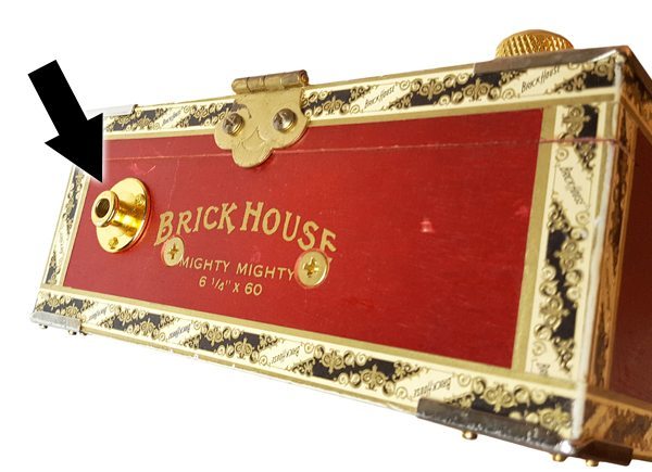 This cigar box guitar utilizes a gold strap button endpin jack from C. B. Gitty