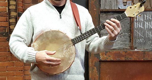 A strap allows an instrument to hang comfortably from musician's shoulders while standing.